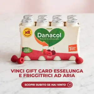 Confezione da 8 Danacol Frutti Rossi su un piano di marmo bianco con lamponi freschi