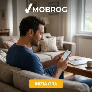 Uomo sul divano che risponde a un sondaggio Mobrog dallo smartphone